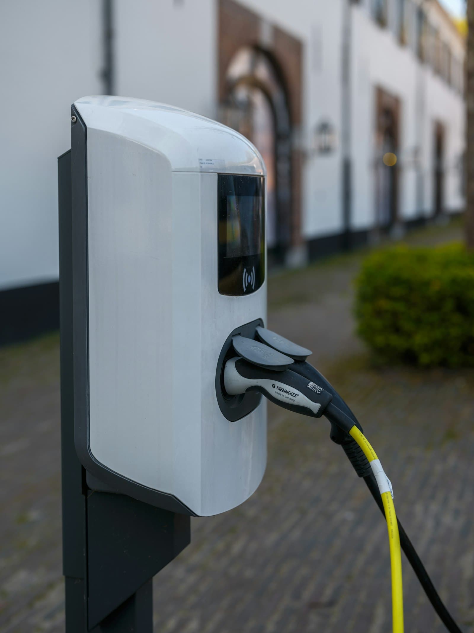 An electric vehicle charging station with the cable plugged in