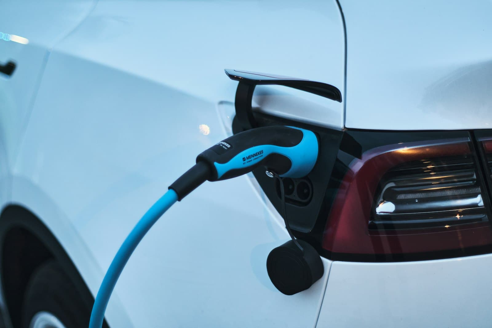 An electric car being charged at a charging station