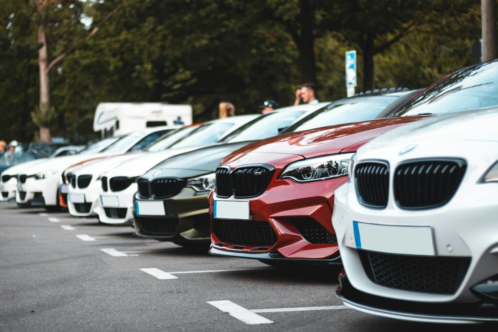 A row of cars parked in a lot