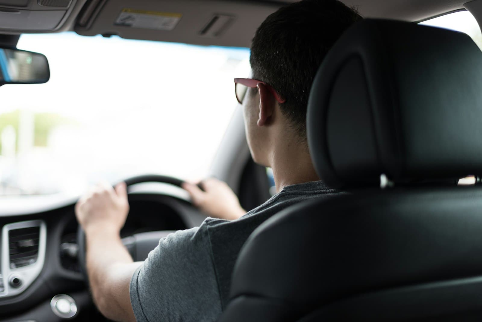 A driver at the wheel of a car